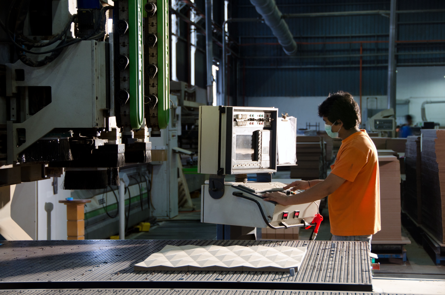 Novel Interior operator working at a panel processing machine in the factory